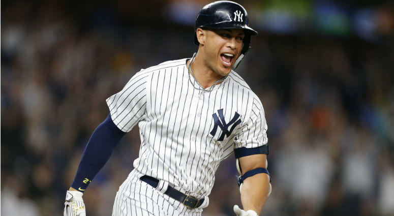 Giancarlo Stanton rounds the bases after hitting a walk off home run against the Seattle Mariners at Yankee Stadium. Giancarlo Stanton rounds the bases after hitting a walk off home run against the Seattle Mariners at Yankee Stadium.