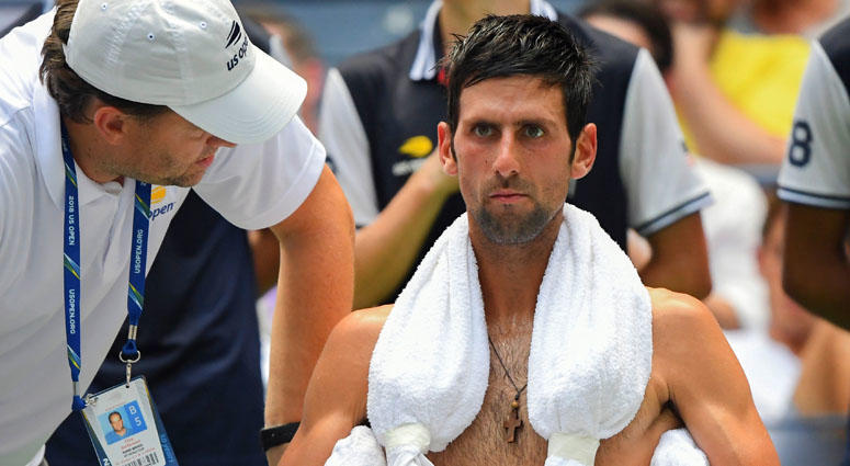 Novak Djokovic copes with the extreme heat while playing Marton Fucsovics in a first round-match at the U.S. Open on Aug. 28, 2018. Novak Djokovic copes with the extreme heat while playing Marton Fucsovics in a first round-match at the U.S. Open on Aug. 28, 2018.