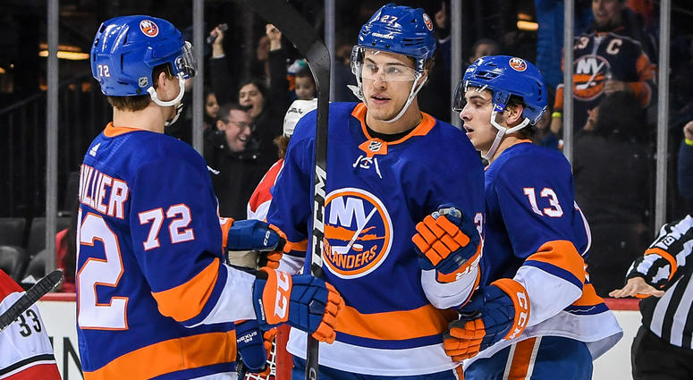 Mar 18, 2018; Islanders left wing Anders Lee celebrates his goal against the Carolina Hurricanes during the second period at Barclays Center. Mandatory Credit: Dennis Schneidler-USA TODAY Sports Mar 18, 2018; Islanders left wing Anders Lee celebrates his goal against the Carolina Hurricanes during the second period at Barclays Center. Mandatory Credit: Dennis Schneidler-USA TODAY Sports