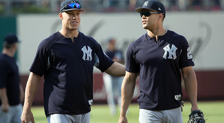 Jun 26, 2018; Philadelphia, PA, USA; New York Yankees right fielder Aaron Judge (99) and left fielder Giancarlo Stanton (27) before a game against the Philadelphia Phillies at Citizens Bank Park. Mandatory Credit: Bill Streicher-USA TODAY Sports Jun 26, 2018; Philadelphia, PA, USA; New York Yankees right fielder Aaron Judge (99) and left fielder Giancarlo Stanton (27) before a game against the Philadelphia Phillies at Citizens Bank Park. Mandatory Credit: Bill Streicher-USA TODAY Sports