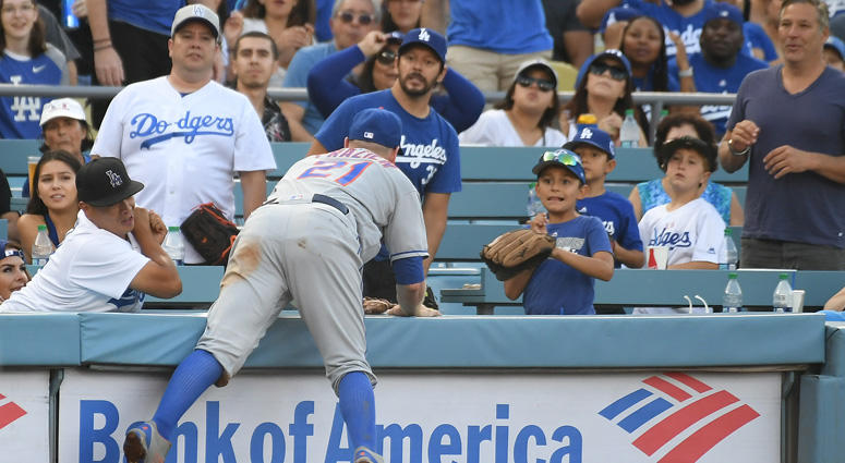 Mets third baseman Todd Frazier chases a foul ball into the stands at Dodger Stadium on Sept. 3, 2018. Mets third baseman Todd Frazier chases a foul ball into the stands at Dodger Stadium on Sept. 3, 2018.