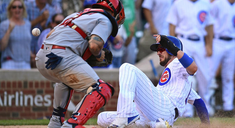 Jul 22, 2017; Chicago, IL, USA; Chicago Cubs third baseman Kris Bryant (right) slides safely into home plate to score against St. Louis Cardinals catcher Yadier Molina (left) in the eighth inning at Wrigley Field.Mandatory Credit: Patrick Gorski-USA TODAY Jul 22, 2017; Chicago, IL, USA; Chicago Cubs third baseman Kris Bryant (right) slides safely into home plate to score against St. Louis Cardinals catcher Yadier Molina (left) in the eighth inning at Wrigley Field.Mandatory Credit: Patrick Gorski-USA TODAY