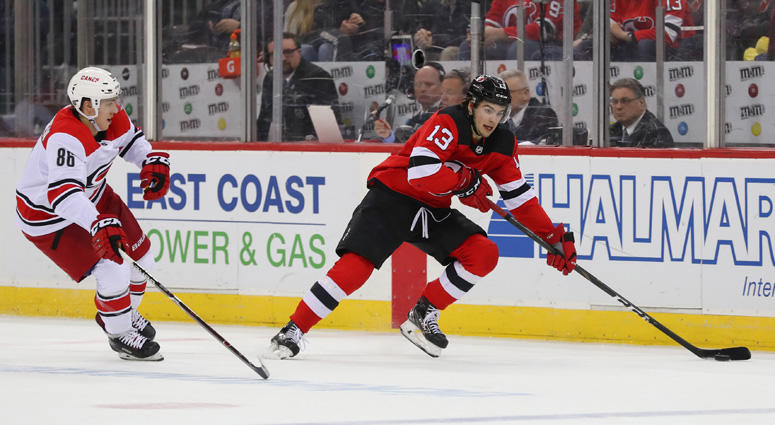 Devils center Nico Hischier skates with the puck past Hurricanes left wing Teuvo Teravainen on Feb. 10, 2019, at the Prudential Center. Devils center Nico Hischier skates with the puck past Hurricanes left wing Teuvo Teravainen on Feb. 10, 2019, at the Prudential Center.