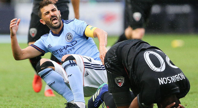 NYCFC forward David Villa reacts after colliding with with D.C. United defender Jalen Robinson for a high ball during the first half on Sept. 9, 2018, at Yankee Stadium. NYCFC forward David Villa reacts after colliding with with D.C. United defender Jalen Robinson for a high ball during the first half on Sept. 9, 2018, at Yankee Stadium.