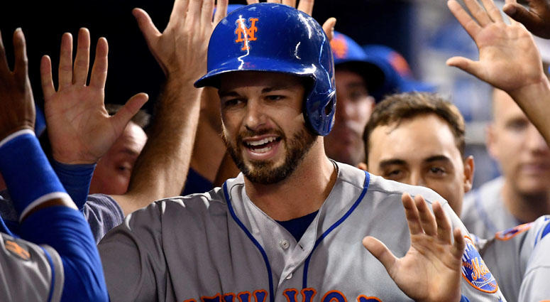 Apr 11, 2018; Miami, FL, USA; New York Mets catcher Kevin Plawecki (26) celebrates with teammates after scoring a run against the Miami Marlins in the eighth inning during a MLB game at Marlins Park. Mandatory Credit: Steve Mitchell-USA TODAY Sports