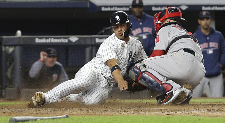 The Yankees' Gleyber Torres is tagged out by Red Sox catcher Christian Vazquez while trying to score on May 8, 2018 at Yankee Stadium. The Yankees' Gleyber Torres is tagged out by Red Sox catcher Christian Vazquez while trying to score on May 8, 2018 at Yankee Stadium.