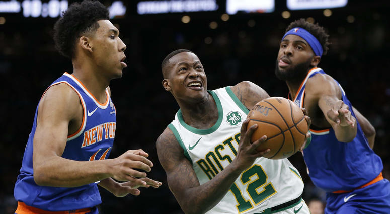 Dec 6, 2018; Boston, MA, USA; Boston Celtics guard Terry Rozier (12) is guarded by New York Knicks guard Allonzo Trier (14) and center Mitchell Robinson (26) during the second half at TD Garden. Mandatory Credit: Greg M. Cooper-USA TODAY Sports Dec 6, 2018; Boston, MA, USA; Boston Celtics guard Terry Rozier (12) is guarded by New York Knicks guard Allonzo Trier (14) and center Mitchell Robinson (26) during the second half at TD Garden. Mandatory Credit: Greg M. Cooper-USA TODAY Sports