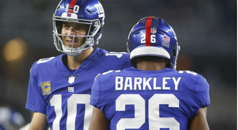 Saquon Barkley and Eli Manning on the field before the game against the Dallas Cowboys at AT&T Stadium. Saquon Barkley and Eli Manning on the field before the game against the Dallas Cowboys at AT&T Stadium.