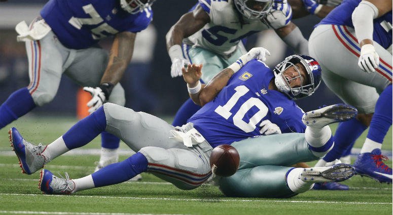 Damien Wilson causes a fumble on a sack of Eli Manning in the third quarter at AT&T Stadium. Damien Wilson causes a fumble on a sack of Eli Manning in the third quarter at AT&T Stadium.