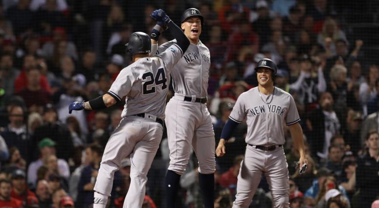 Yankees catcher Gary Sanchez (24) celebrates with right fielder Aaron Judge (99) after hitting an 3-RBI home run during the seventh inning against Boston Red Sox in game two of the 2018 ALDS playoff baseball series at Fenway Park. Yankees catcher Gary Sanchez (24) celebrates with right fielder Aaron Judge (99) after hitting an 3-RBI home run during the seventh inning against Boston Red Sox in game two of the 2018 ALDS playoff baseball series at Fenway Park.