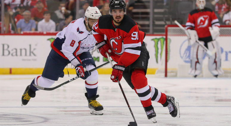 Marcus Johansson skates with the puck while being pursued by Alex Ovechkin during the second period at Prudential Center. Marcus Johansson skates with the puck while being pursued by Alex Ovechkin during the second period at Prudential Center.