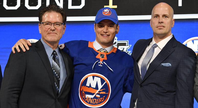 Islanders' first-round draft pick Oliver Wahlstrom poses with with team representatives after being selected as the 11th overall pick. Islanders' first-round draft pick Oliver Wahlstrom poses with with team representatives after being selected as the 11th overall pick.