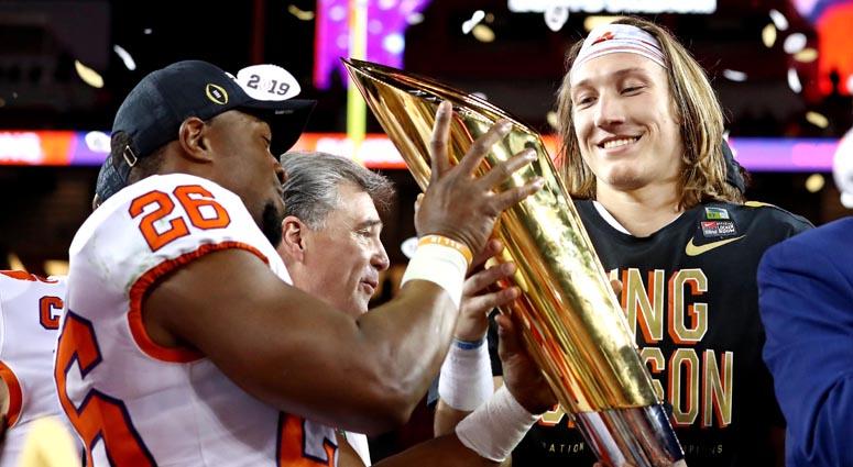 Clemson quarterback Trevor Lawrence, right, celebrates with the national championship trophy after beating Alabama during the College Football Playoff championship game on Jan. 7, 2019, at Levi's Stadium in Santa Clara, California. Clemson quarterback Trevor Lawrence, right, celebrates with the national championship trophy after beating Alabama during the College Football Playoff championship game on Jan. 7, 2019, at Levi's Stadium in Santa Clara, California.