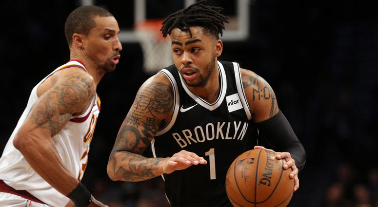 Nets point guard D'Angelo Russell drives around Cleveland Cavaliers point guard George Hill on March 25, 2018, at the Barclays Center. Nets point guard D'Angelo Russell drives around Cleveland Cavaliers point guard George Hill on March 25, 2018, at the Barclays Center.