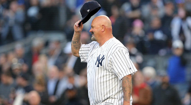 Apr 23, 2018; Bronx, NY, USA; New York Yankees former pitcher David Wells tips his cap to the fans before throwing out the ceremonial first pitch before a game against the Minnesota Twins at Yankee Stadium. Mandatory Credit: Brad Penner-USA TODAY Sports