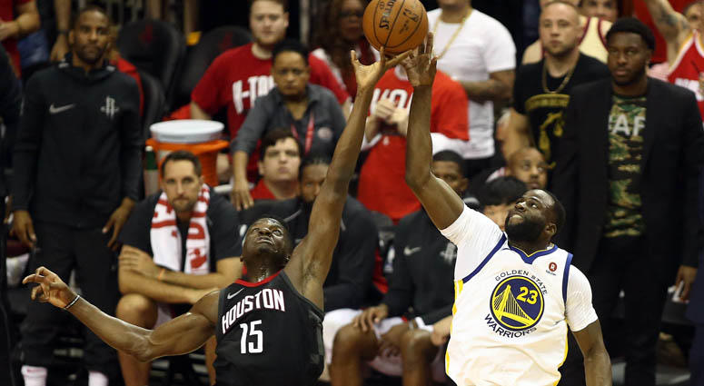 The Rockets' Clint Capela (15) plays for the ball against the Warriors' Draymond Green (23) during Game 2 of the Western Conference finals on May 16, 2018, at the Toyota Center in Houston. The Rockets' Clint Capela (15) plays for the ball against the Warriors' Draymond Green (23) during Game 2 of the Western Conference finals on May 16, 2018, at the Toyota Center in Houston.