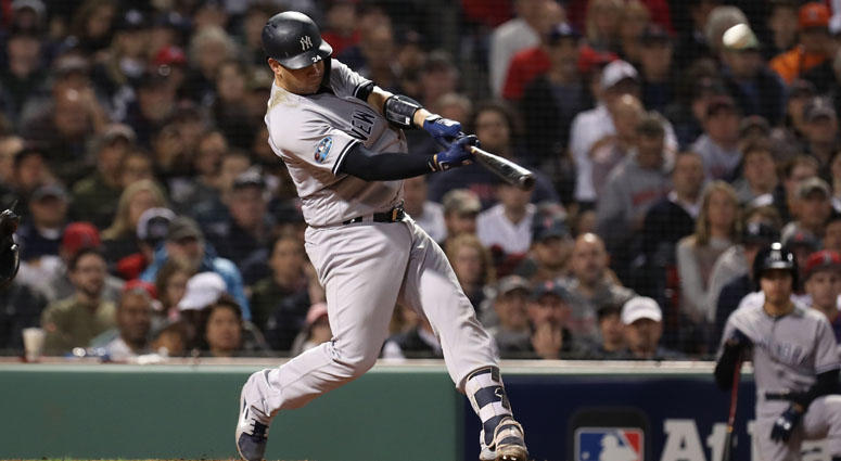 Yankees catcher Gary Sanchez (24) hits an 3-RBI home run during the seventh inning against Boston Red Sox in game two of the 2018 ALDS playoff baseball series at Fenway Park. Yankees catcher Gary Sanchez (24) hits an 3-RBI home run during the seventh inning against Boston Red Sox in game two of the 2018 ALDS playoff baseball series at Fenway Park.