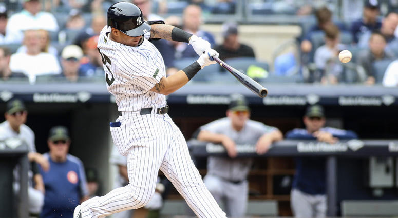 May 28, 2018; Bronx, NY, USA; New York Yankees second baseman Gleyber Torres (25) hits a single in the second inning against the Houston Astros at Yankee Stadium. Mandatory Credit: Wendell Cruz-USA TODAY Sports