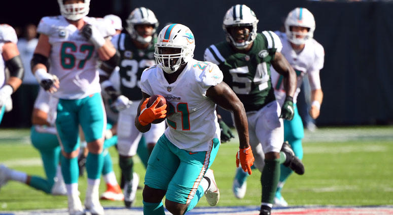 Miami Dolphins running back Frank Gore runs for a first down on a third-and-19 play in the fourth quarter on Sept. 16, 2018, at MetLife Stadium. Miami Dolphins running back Frank Gore runs for a first down on a third-and-19 play in the fourth quarter on Sept. 16, 2018, at MetLife Stadium.