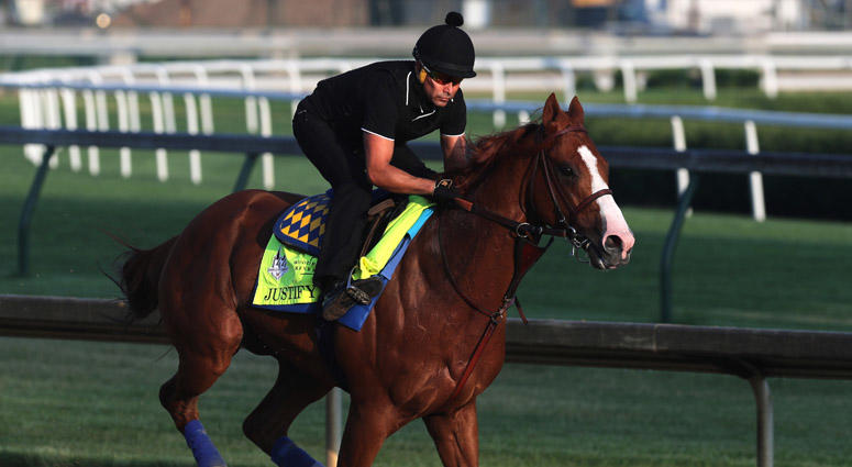 Kentucky Derby and Preakness winner Justify and exercise rider Humberto Gomez take to the track on May 28, 2018, in Louisville, Kentucky. Kentucky Derby and Preakness winner Justify and exercise rider Humberto Gomez take to the track on May 28, 2018, in Louisville, Kentucky.