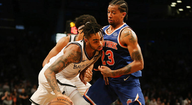 Nets guard D'Angelo Russell dribbles the ball while being defended by Knicks guard Trey Burke on Oct. 3, 2018, at Barclays Center. Nets guard D'Angelo Russell dribbles the ball while being defended by Knicks guard Trey Burke on Oct. 3, 2018, at Barclays Center.