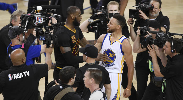 Golden State Warriors guard Stephen Curry greets Cleveland Cavaliers forward LeBron James after Game 5 of the NBA Finals on June 13, 2018, at Oracle Arena in Oakland, California. Golden State Warriors guard Stephen Curry greets Cleveland Cavaliers forward LeBron James after Game 5 of the NBA Finals on June 13, 2018, at Oracle Arena in Oakland, California.