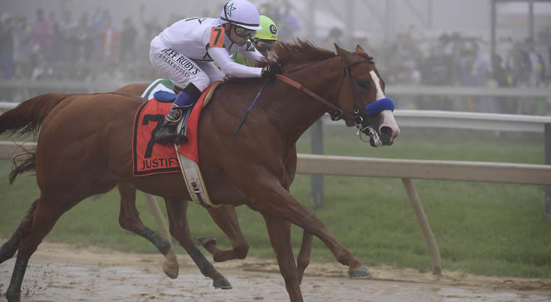 Mike Smith aboard Justify (7) passes Jose L. Ortiz aboard Good Magic (5) during the 143rd running of the Preakness Stakes on May 19, 2018, at Pimlico Race Course in Baltimore, Maryland. Mike Smith aboard Justify (7) passes Jose L. Ortiz aboard Good Magic (5) during the 143rd running of the Preakness Stakes on May 19, 2018, at Pimlico Race Course in Baltimore, Maryland.