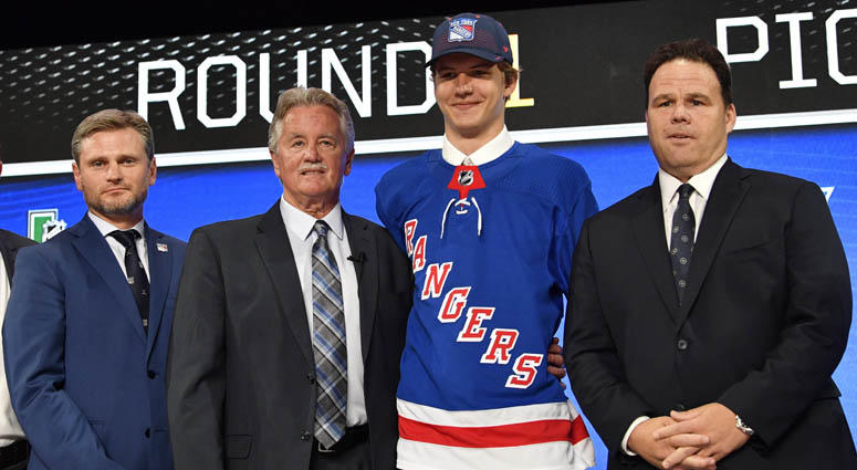 Vitali Kravtsov poses for a photo with team representatives after being selected as the ninth overall pick by the New York Rangers in the first round of the 2018 NHL Draft at American Airlines Center in Dallas. Vitali Kravtsov poses for a photo with team representatives after being selected as the ninth overall pick by the New York Rangers in the first round of the 2018 NHL Draft at American Airlines Center in Dallas.
