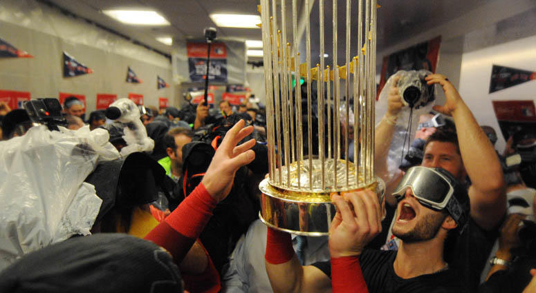 Boston Red Sox players celebrate with the Commissioner's Trophy in the clubhouse after defeating the Los Angeles Dodgers in game five of the 2018 World Series at Dodger Stadium. Boston Red Sox players celebrate with the Commissioner's Trophy in the clubhouse after defeating the Los Angeles Dodgers in game five of the 2018 World Series at Dodger Stadium.