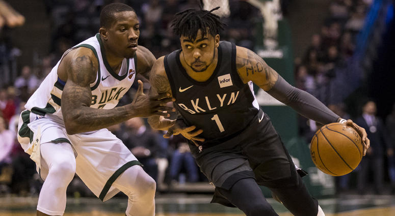Nets guard D'Angelo Russell drives to the basket around Milwaukee Bucks guard Eric Bledsoe on April 5, 2018, at BMO Harris Bradley Center in Milwaukee, Wisconsin. Nets guard D'Angelo Russell drives to the basket around Milwaukee Bucks guard Eric Bledsoe on April 5, 2018, at BMO Harris Bradley Center in Milwaukee, Wisconsin.
