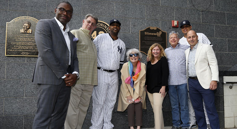 Representatives of the Stonewall Inn and New York Yankees pose for a photograph at the newly unveiled plaque in Monument Park honoring the 50th anniversary of the Stonewall Inn uprising. Representatives of the Stonewall Inn and New York Yankees pose for a photograph at the newly unveiled plaque in Monument Park honoring the 50th anniversary of the Stonewall Inn uprising.