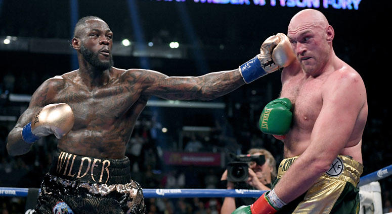 Deontay Wilder punches Tyson Fury in the ninth round fighting to a draw during the WBC heavyweight championship at Staples Center on Dec. 1, 2018 in Los Angeles, California. Deontay Wilder punches Tyson Fury in the ninth round fighting to a draw during the WBC heavyweight championship at Staples Center on Dec. 1, 2018 in Los Angeles, California.