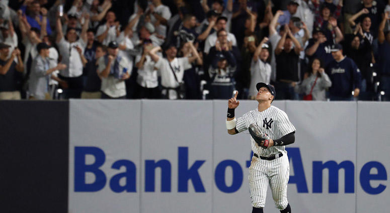 Aaron Judge #99 of the New York Yankees celebrates after defeating the Oakland Athletics by a score of 7-2 to win the American League Wild Card Game at Yankee Stadium on October 03, 2018. Aaron Judge #99 of the New York Yankees celebrates after defeating the Oakland Athletics by a score of 7-2 to win the American League Wild Card Game at Yankee Stadium on October 03, 2018.