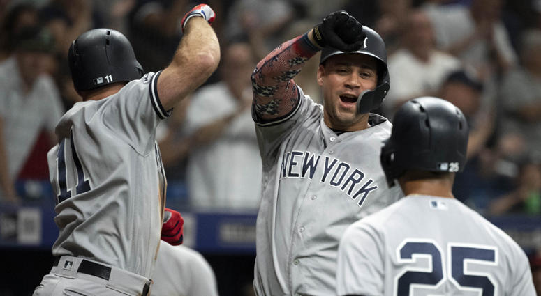 The Yankees' Brett Gardner (left) celebrates with Gary Sanchez (center) after hitting a three-run home run against the Tampa Bay Rays on July 5, 2019, at Tropicana Field in St. Petersburg, Florida. The Yankees' Brett Gardner (left) celebrates with Gary Sanchez (center) after hitting a three-run home run against the Tampa Bay Rays on July 5, 2019, at Tropicana Field in St. Petersburg, Florida.