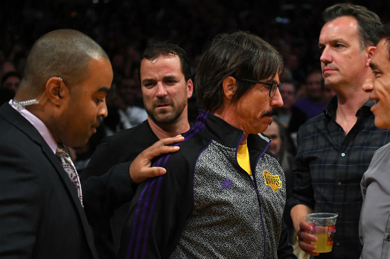 Anthony Kiedis, lead singer of the band Red Hot Chili Pepper, is escorted off the floor after he yelled profanities at Houston Rockets guard Chris Paul Anthony Kiedis, lead singer of the band Red Hot Chili Pepper, is escorted off the floor after he yelled profanities at Houston Rockets guard Chris Paul