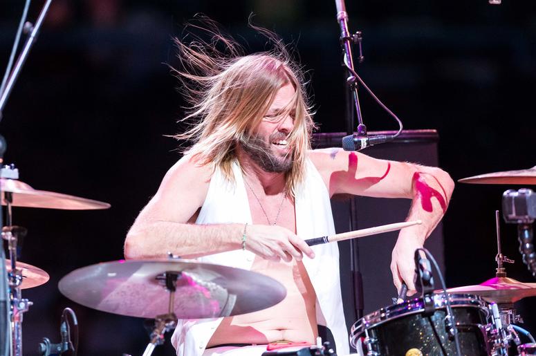 Taylor Hawkins of the band Chevy Metal performs following the NBA game between the Charlotte Hornets and Milwaukee Bucks Taylor Hawkins of the band Chevy Metal performs following the NBA game between the Charlotte Hornets and Milwaukee Bucks