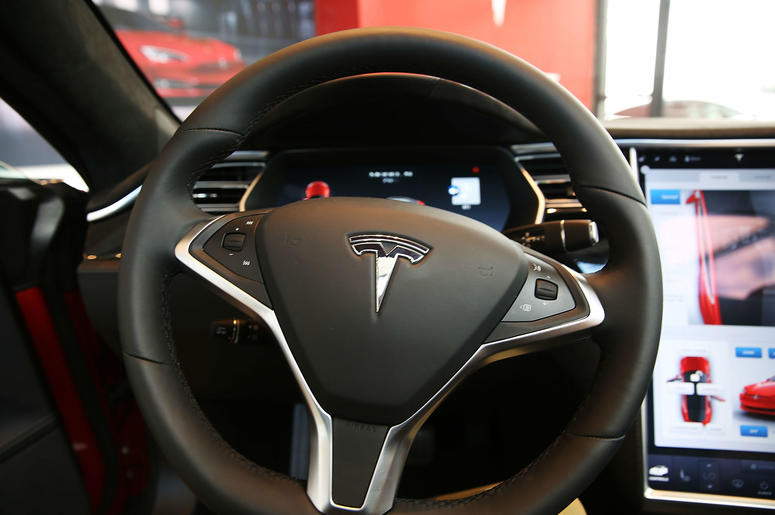 A Tesla being driven on autopilot caught fire. A Tesla being driven on autopilot caught fire.