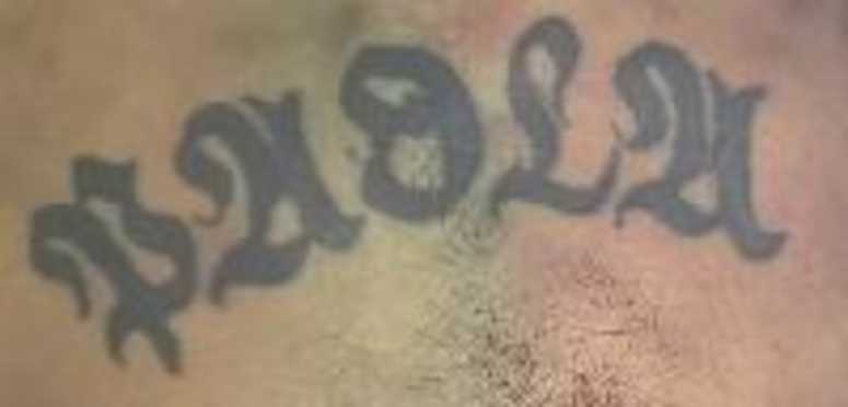 A tattoo on a man who was found dead inside of a Queens donation box. A tattoo on a man who was found dead inside of a Queens donation box.