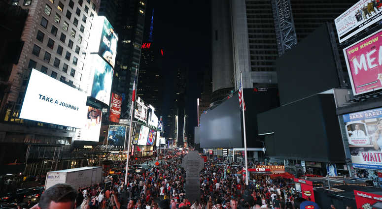 Screens in Times Square are black during a power outage, Saturday, July 13, 2019, in New York. NYC Blackout ap