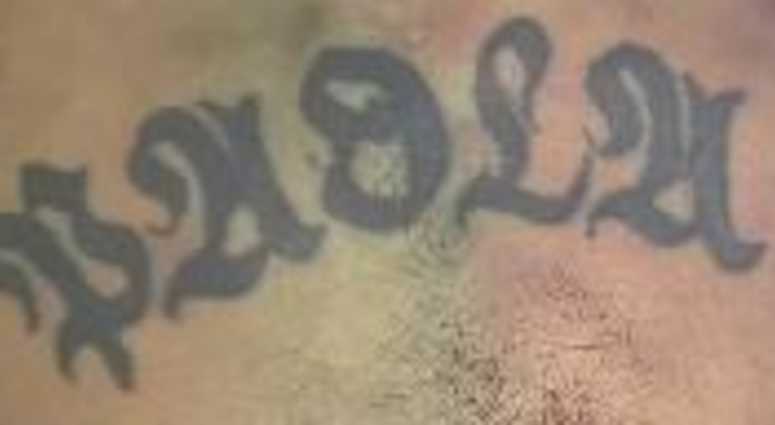 A tattoo on a man who was found dead inside of a Queens donation box. A tattoo on a man who was found dead inside of a Queens donation box.