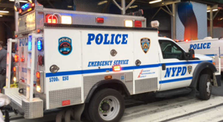An NYPD vehicle sits on a city street. An NYPD vehicle sits on a city street.