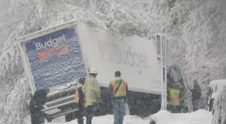 Croton Falls firefighters assist an injured driver after his truck went off of Route 121