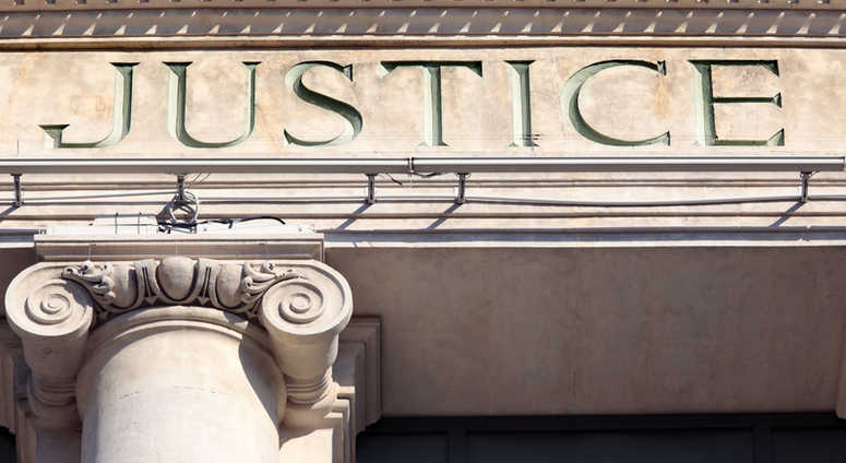 Justice sign on a Courtroom Building. Justice sign on a Courtroom Building.