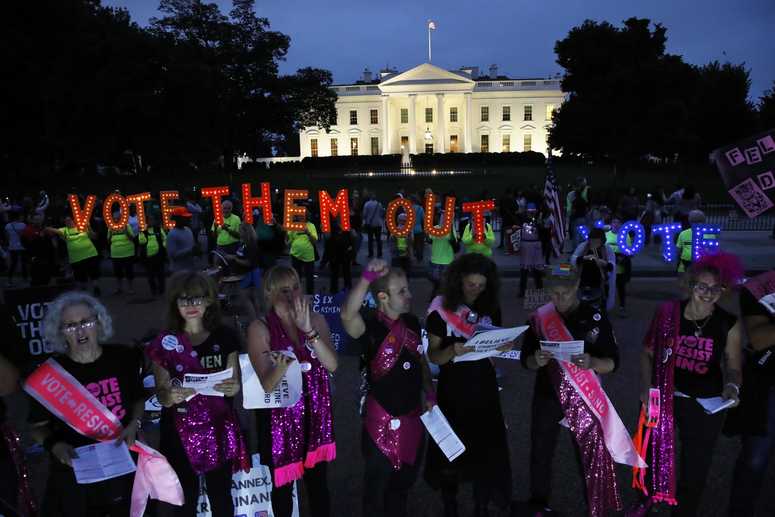 As dusk falls, groups including "Sing Out Louise," of New York City, protest the confirmation of Brett Kavanaugh to the Supreme Court. Protests White House