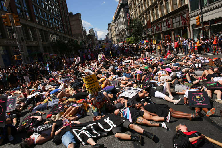 Activists lie on Sixth Avenue during the Queer Liberation March on June 30, 2019 in New York City. Queer Liberation March