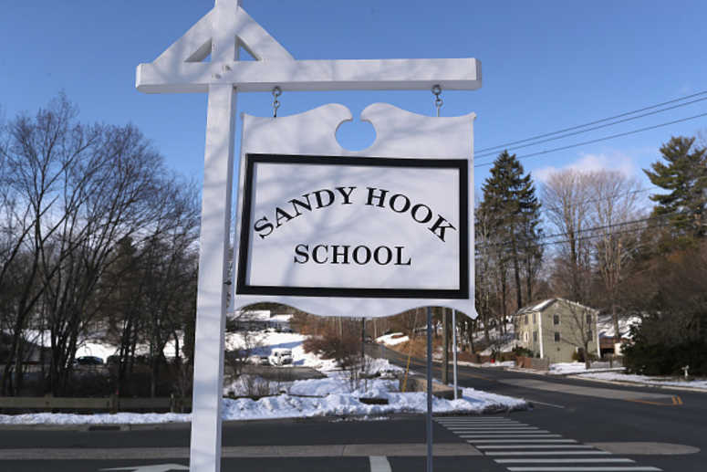 A sign stands near the site of the December 2012 Sandy Hook school shooting A sign stands near the site of the December 2012 Sandy Hook school shooting