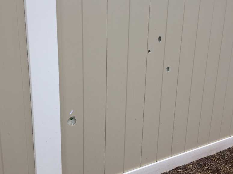 Bullet holes in PVC fencing on Long Island Party shooting