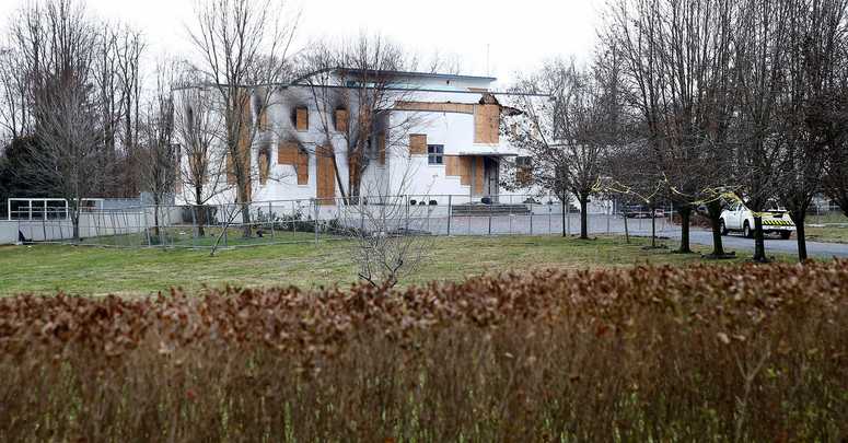 Fences and No Trespassing signs surround the Willow Brook Road home in Colts Neck Monday, November 26, 2018, where four members of the Caneiro family died. Colts Neck