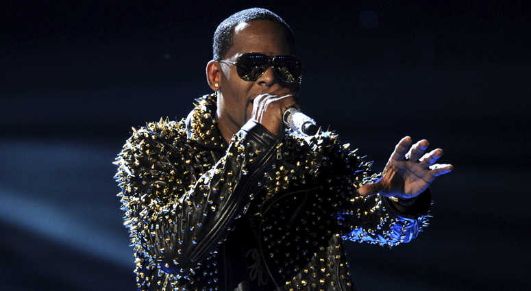 In this June 30, 2013, file photo, R. Kelly performs onstage at the BET Awards at the Nokia Theatre in Los Angeles. R. Kelly