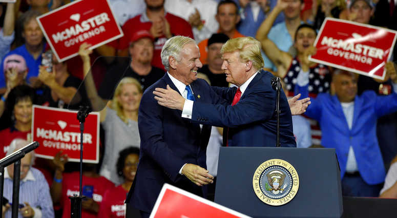 President Donald Trump greets Gov. Henry McMaster